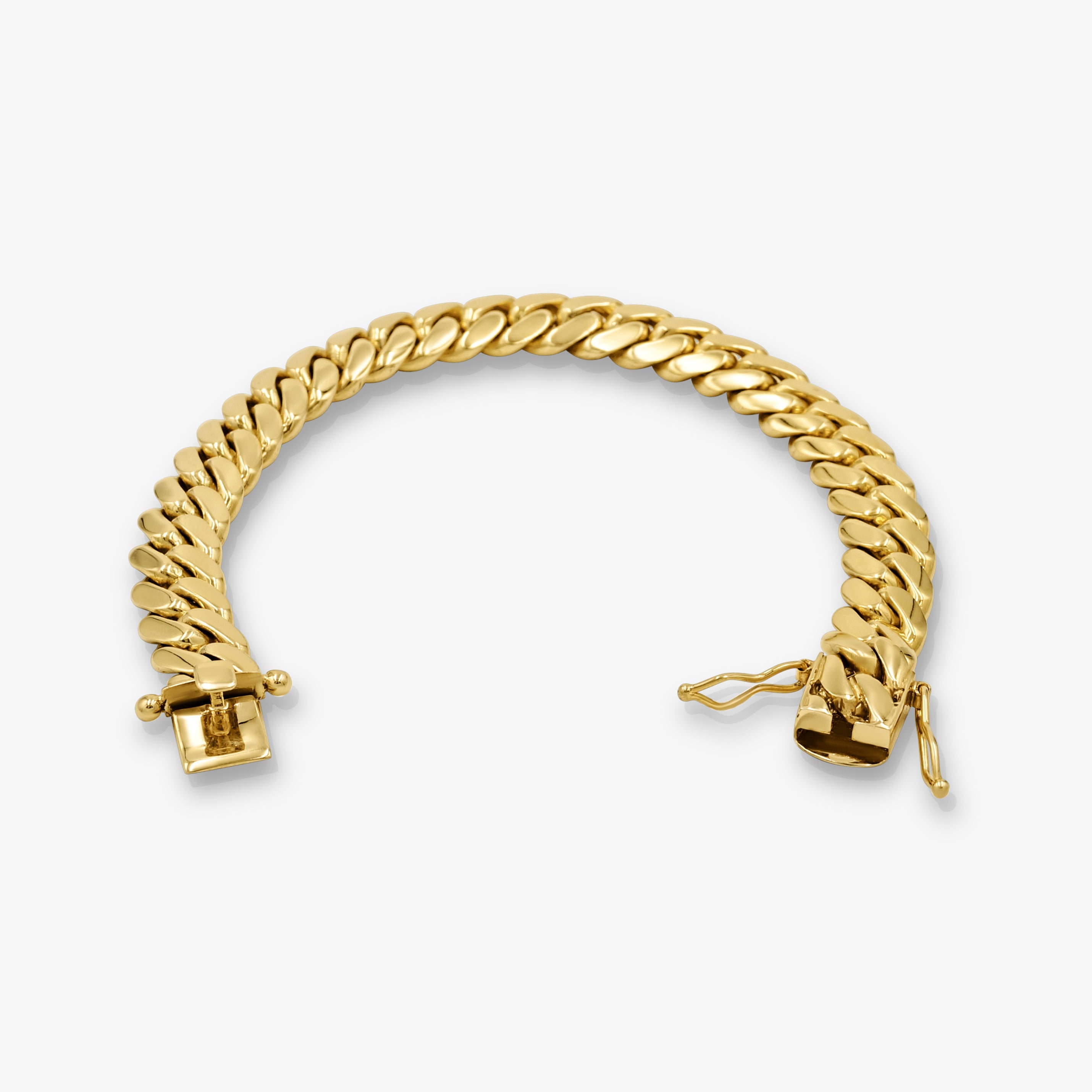 Close-up of 8mm solid gold Cuban link bracelet at Mayra Jewelry