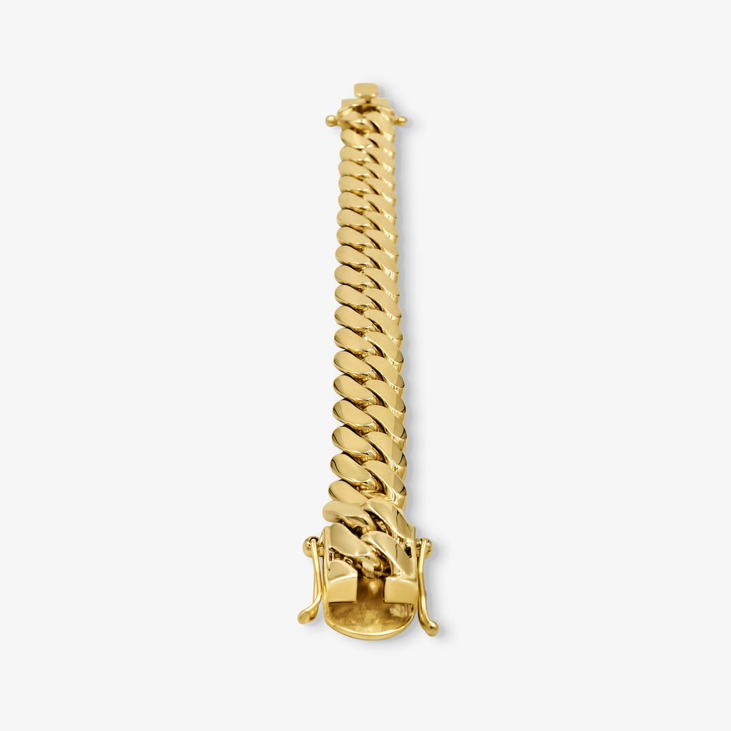 Detail view of 16mm solid gold Cuban link bracelet at Mayra Jewelry