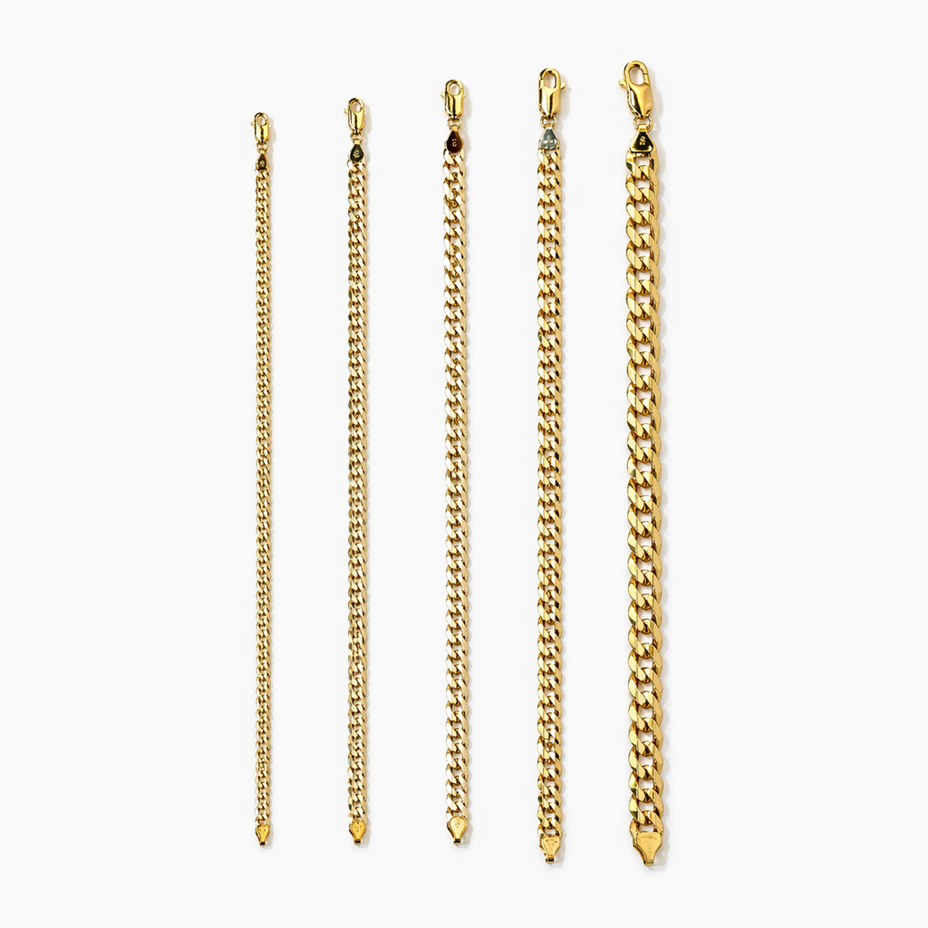 Close-up of yellow gold flat curb bracelet links at Mayra Jewelry