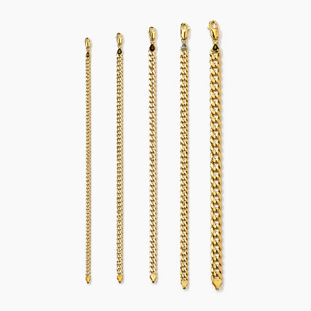 Close-up of yellow gold flat curb bracelet links at Mayra Jewelry