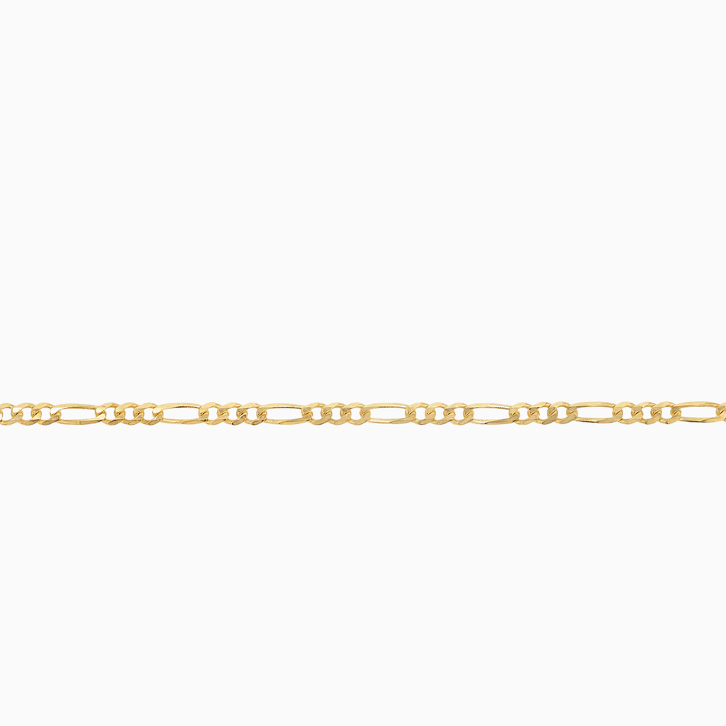Close-up of 10K yellow gold mini Figaro chain links at Mayra Jewelry