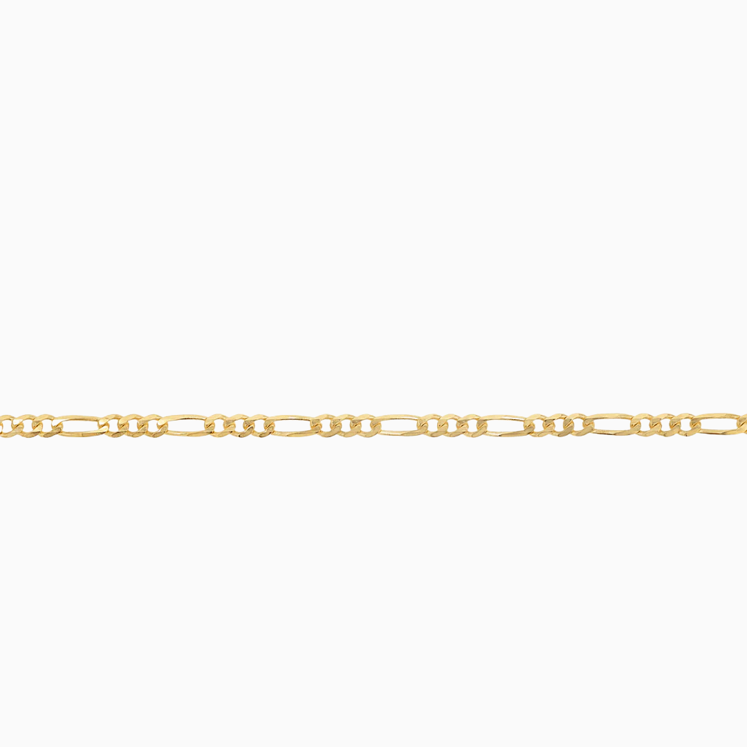 Close-up of 10K yellow gold mini Figaro chain links at Mayra Jewelry