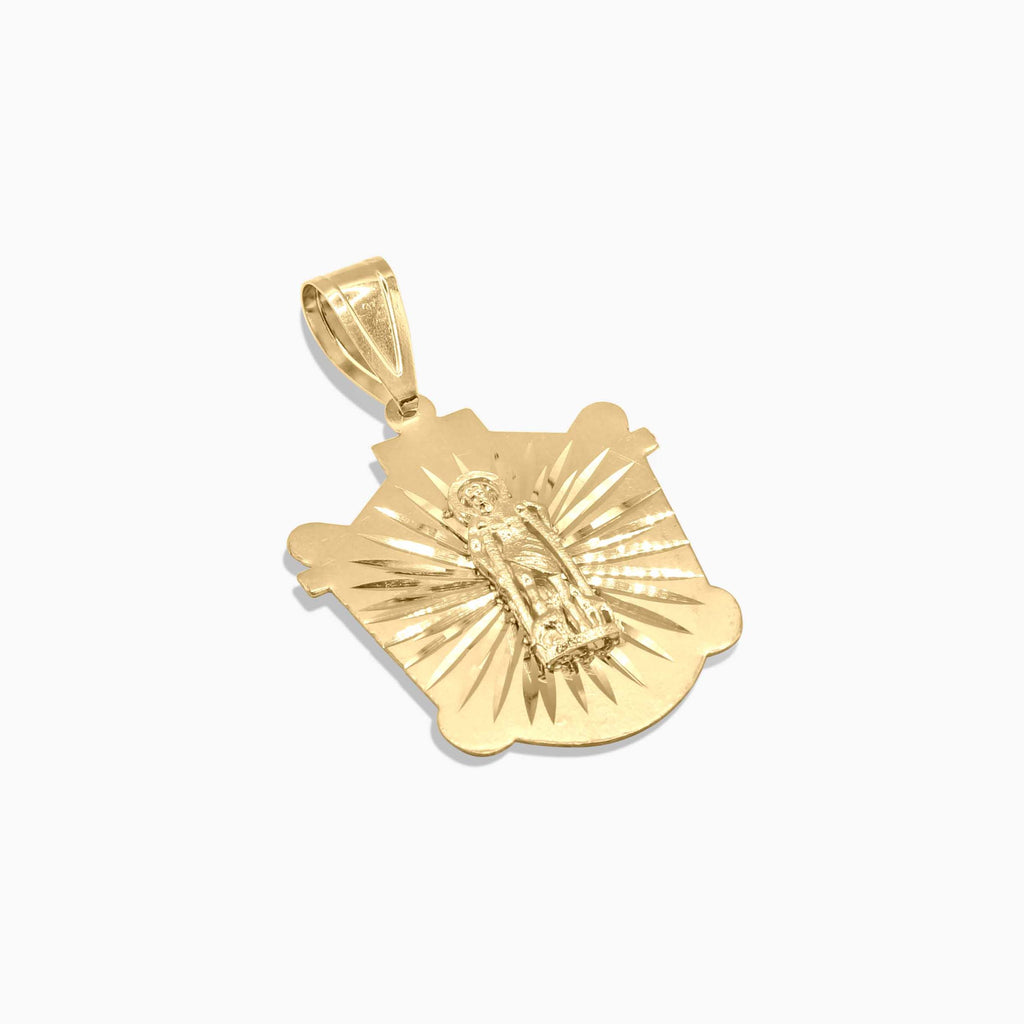 Detail view of Saint Lazarus sunburst gold medallion at Mayra Jewelry