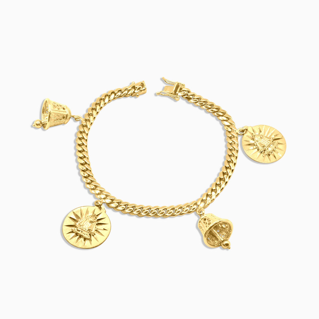 10K gold Cuban link charm bracelet with religious medallions at Mayra Jewelry
